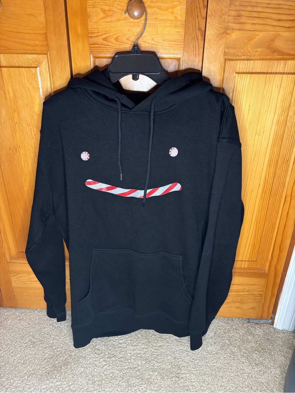 Dream Christmas Hoodie with Candy Stripe Face Graphic